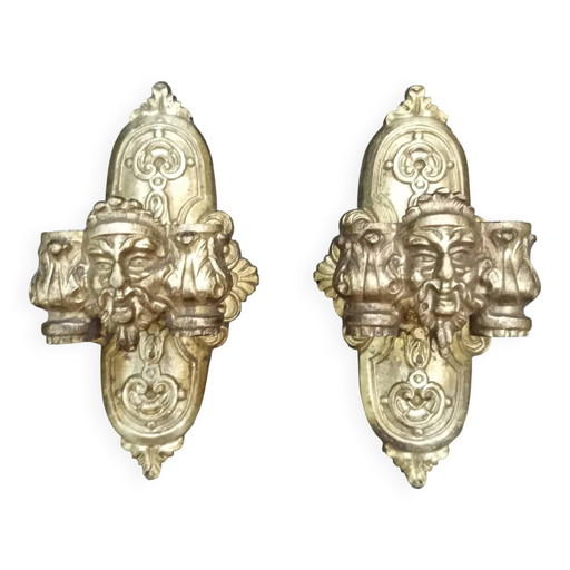 Par de apliques de bronce con máscara, firmado L. Pinet, período Art Nouveau.