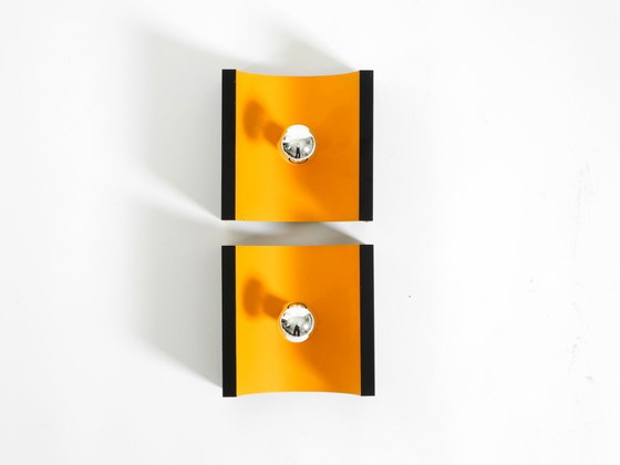 Image 1 of A rare pair of original 1960s Space Age metal wall lamps by Klaus Hempel for Kaiser Leuchten in yellow and black