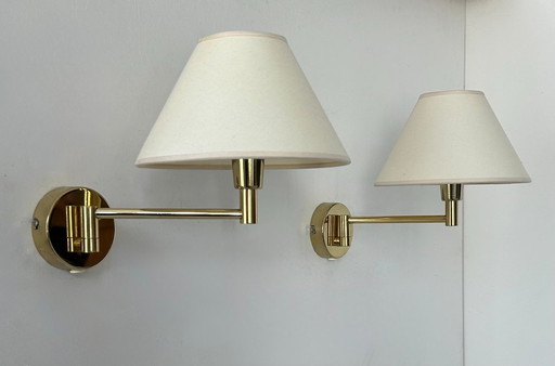Pair of vintage adjustable wall lights, brass and beige fabric, France, 1970
