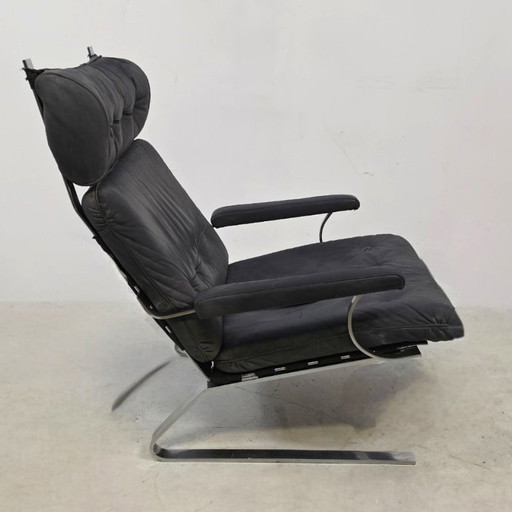 Swing chair 60's chrome met grijs leer