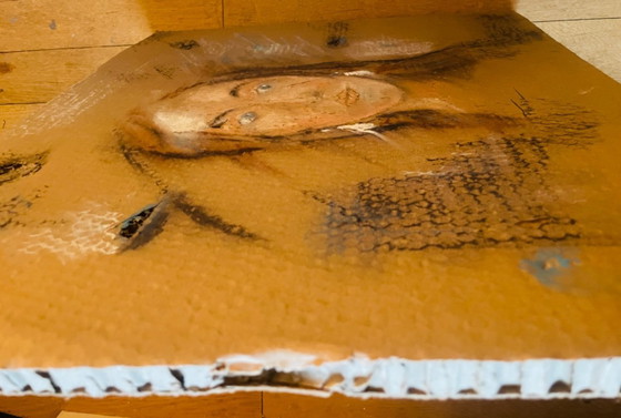 Image 1 of A female portrait painting created on old, worn, honeycomb-patterned cardboard packaging.