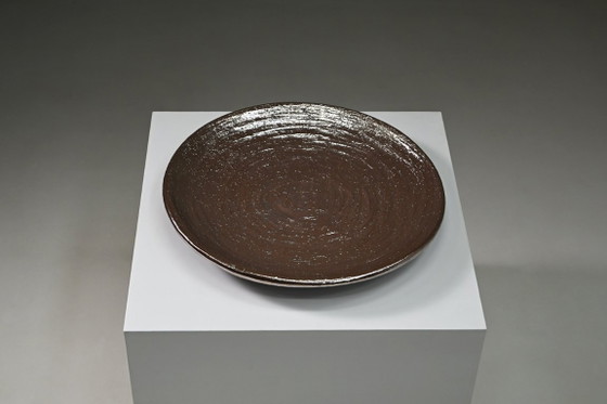 Large handmade metallic glazed ceramic bowl, circa 1980s–1990s. (photo 3 of 8)