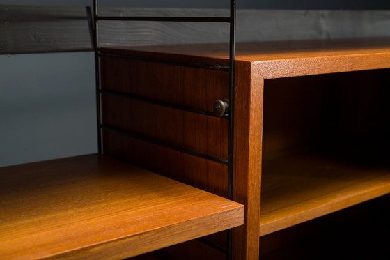 Image 1 of Modulaire wandplank in teak van Nils Strinning voor String, 1960, set van 29