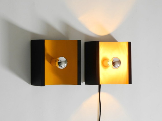 Image 1 of A rare pair of original 1960s Space Age metal wall lamps by Klaus Hempel for Kaiser Leuchten in yellow and black