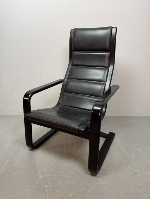 Mid-CenturyDesign Black Leather Lamino Lounge Chair on Black Lacquered Plywood Frame by  Yngve Ekstrom. Denmark, 1970s.