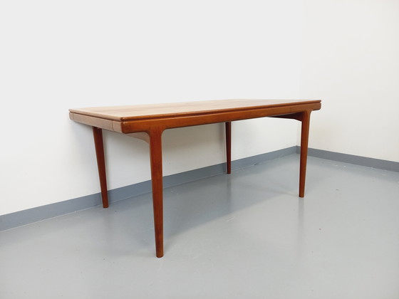 Image 1 of Scandinavian rectangular vintage dining table by Johannes Andersen for Samcom from the 60s in teak with integrated extensions