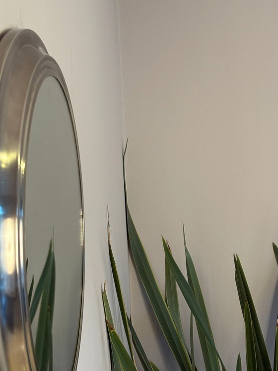 Image 1 of round mirror with metal frame, dating back to the 1970s