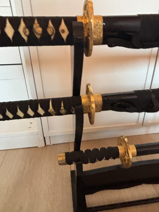 Decorative Daishō samurai sword set with wooden stand