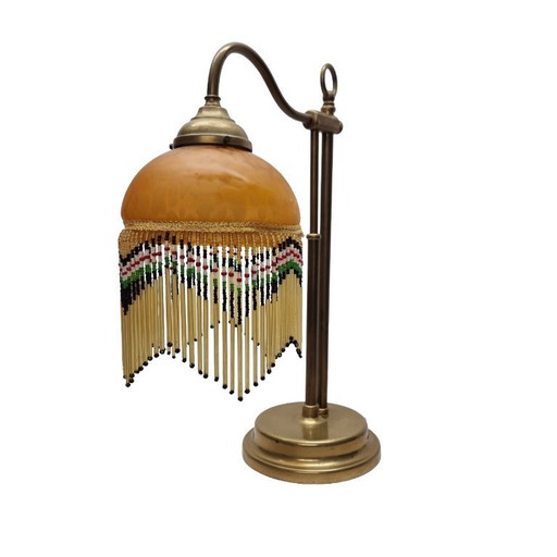 Vintage beaded lamp on a brass base