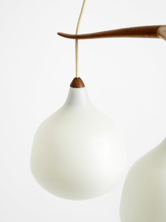 Image 1 of Beautiful pendant lamp with three opal glass shades and a teak frame by Uno & Östen Kristiansson for Luxus Vittsjö, Sweden 1957