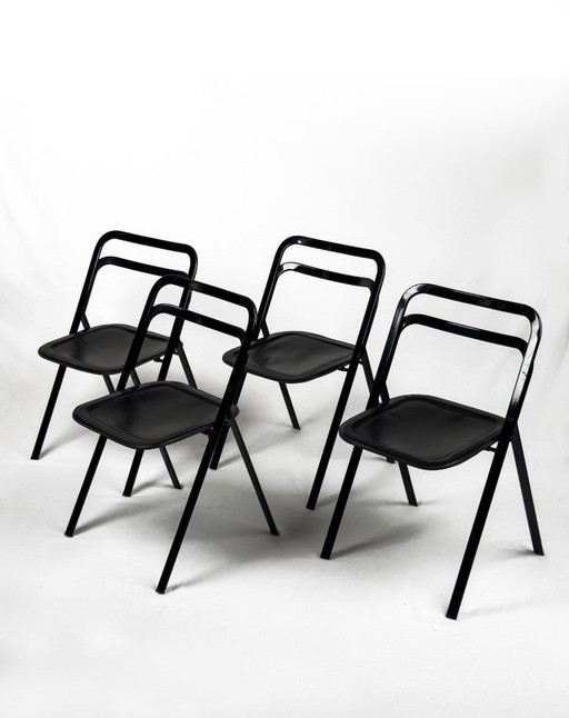 4 sedie pieghevoli “Clio” in metallo nero e pelle di Giorgio Cattelan