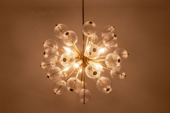 Image 1 of Kamenicky Senov, editor. Pair of brass and glass chandeliers. Circa 1970