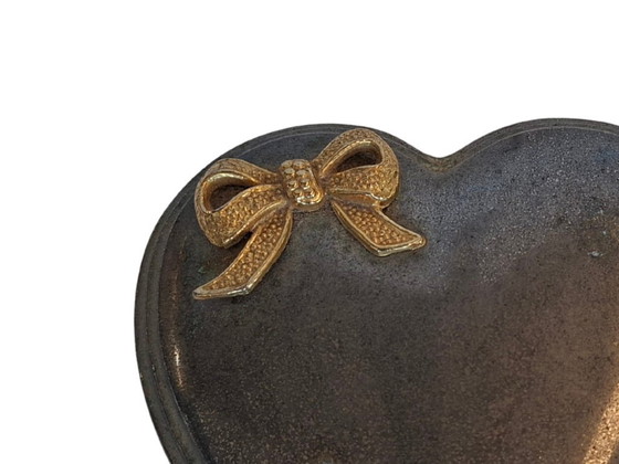 Image 1 of Heart-Shaped Metal Jewelry Box with Gold Bow and Red Velvet Interior
