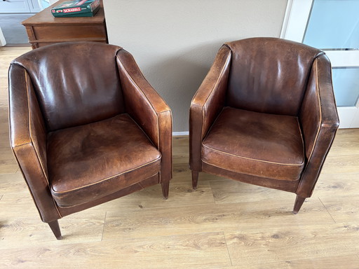 2 vintage schapenleren clubfauteuils 