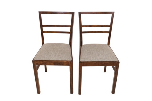A pair of Art Deco chairs from the mid-20th century.