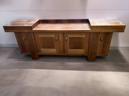 Walnut sideboard designed by Silvio Coppola for Bernini, 1960–1970, expresses the Italian craftsmanship of the period