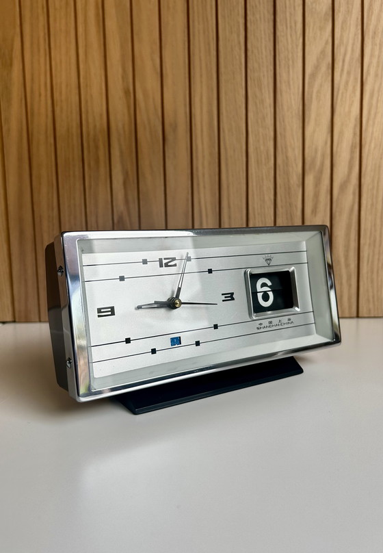 Image 1 of Vintage desk clock with flip date, made in Shanghai China.