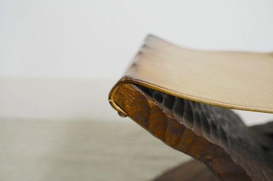 Image 1 of Brutalist Folding Stool Leather Sling Seat Hand Carved Wood X Frame 1950s Rustic Mid Century Ottoman