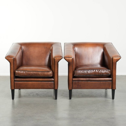 2 poltrone/poltrone lounge in elegante pelle di pecora dal design Art Déco con profili neri