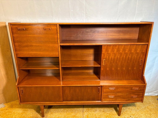 Danish-Style Mid Century Modern Teak Highboard by Elliotts of Newbury (Circa 1960)  A striking mid century modern teak highboard
