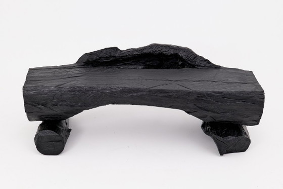 Image 1 of Bank van massief verkoold hout van Logniture – een organisch, modern en sculpturaal zitmeubel.