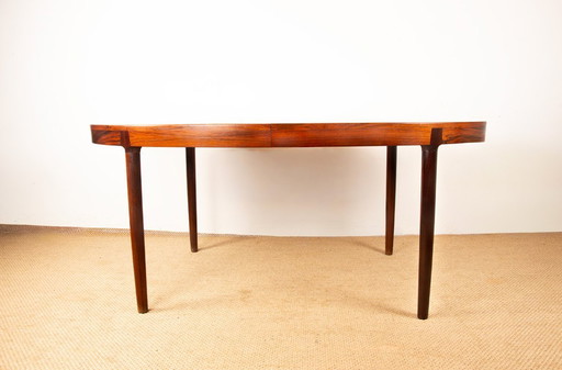 Grande tavolo da pranzo ovale estensibile in palissandro danese di Harry Østergaard per Randers Mobelfabrik 1960.