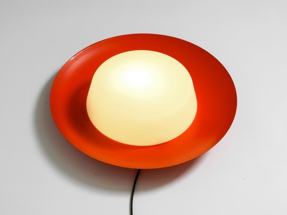 Image 1 of Grote Mid Century wand- of plafondlamp van glas met metalen reflector in rood van Kaiser Leuchten