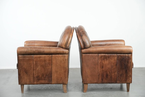 Image 1 of 2 x Vintage sheepskin armchair with warm colours and a characterful appearance