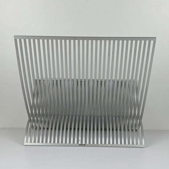 Image 1 of Soporte para libros y revistas UMBRA de lamas de aluminio cepillado. Plegable diseñador MICHELLE IVANKOVIC