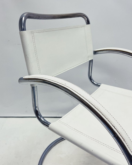 Image 1 of Vintage tubular frame chairs with white skai