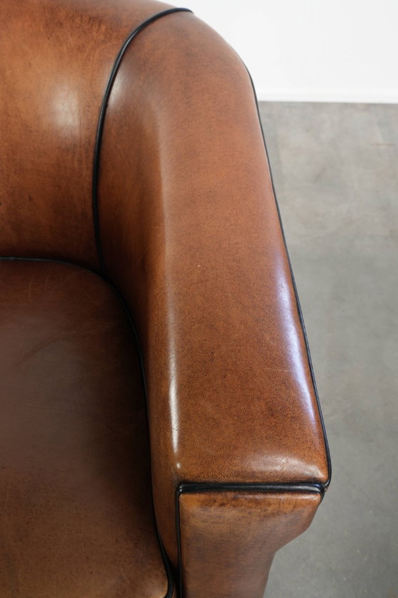 Image 1 of 2x schapenleren Art Deco design clubfauteuil met een mooi patina, zwarte biezen en mooie kleuren