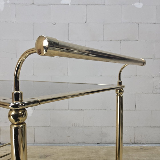 Vintage golden brass bar cart / trolley smoked glass shelves (photo 11 of 15)