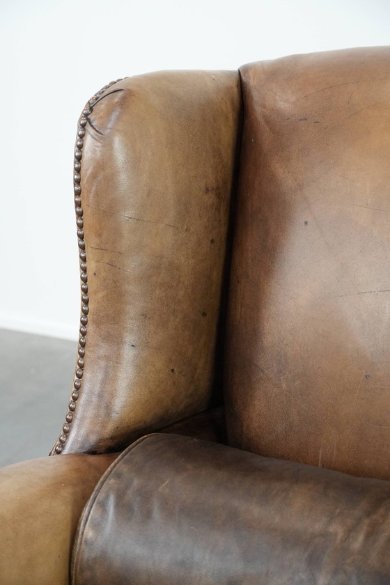 Image 1 of Ohrensessel im englischen Stil aus Kuhfell