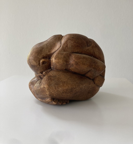 Wood carved figurine of weeping buddha