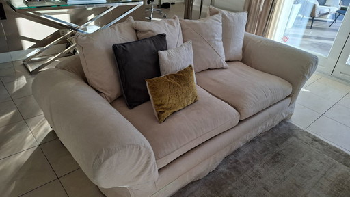 Spacious 2-seater fabric sofa with cushions