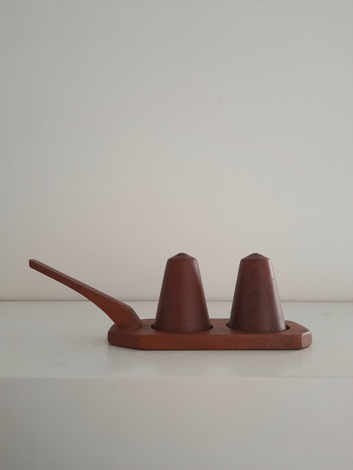 Pepper and salt on teak display stand
