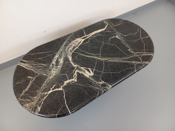 Image 1 of Vintage oval coffee table in black marble from the 1970s