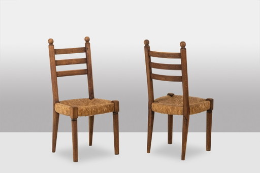 Set of 8 oak straw-seated chairs. 1950s.