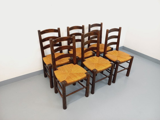 Image 1 of Set van 6 vintage brutalistische stoelen van Georges Robert, gemaakt van hout en stro, uit de jaren 50 en 60.