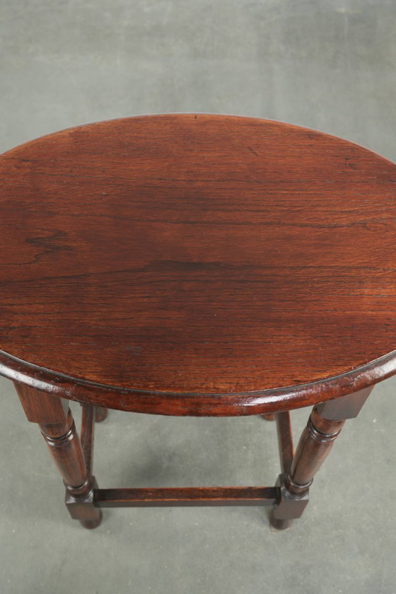 Image 1 of Antique oval English oak side table from the early 20th century with beautiful colors
