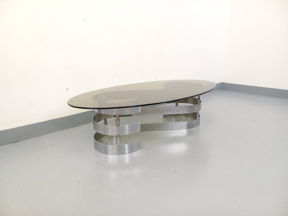 Image 1 of Vintage ovale salontafel van rookglas en verchroomd metaal uit de jaren 70.