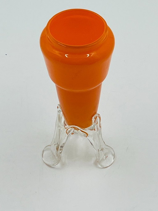 Vintage orange glass bud vase with a sculpted base