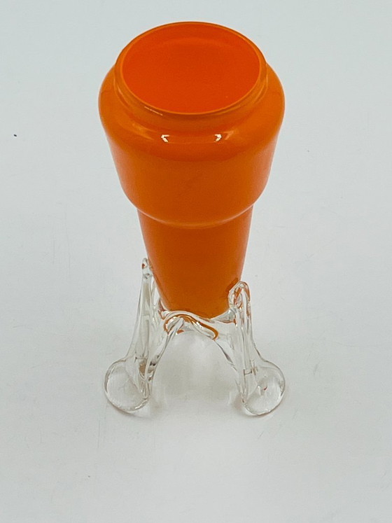 Image 1 of Vintage orange glass bud vase with a sculpted base