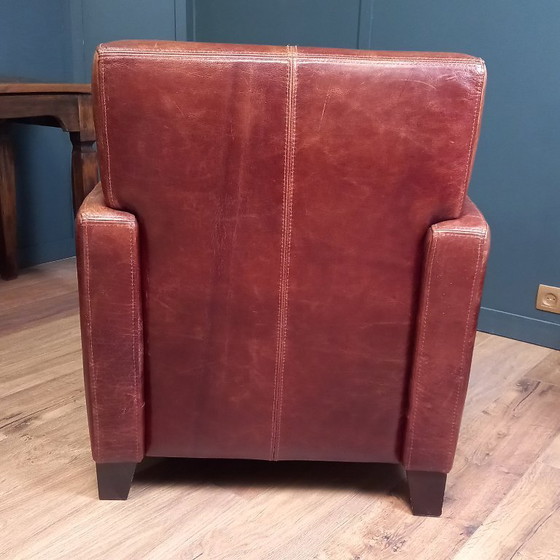 Image 1 of Timeless cowhide leather club armchair, atmospheric and inviting.
