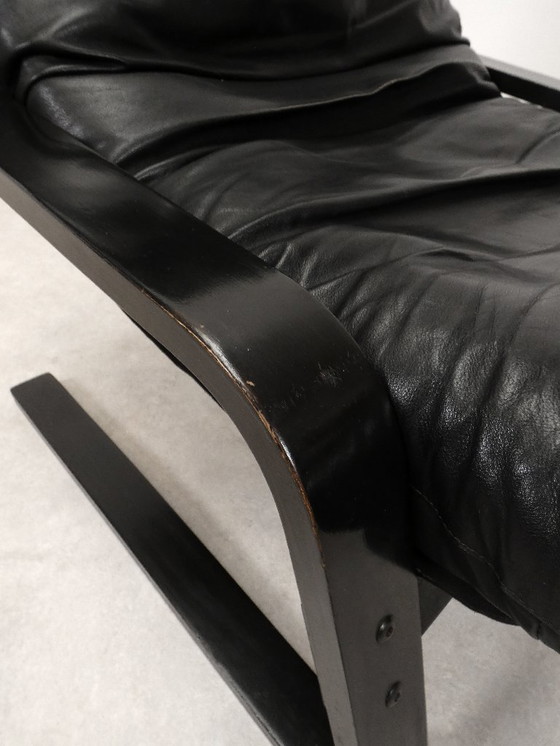 Image 1 of  high-back lounge chair in black leather