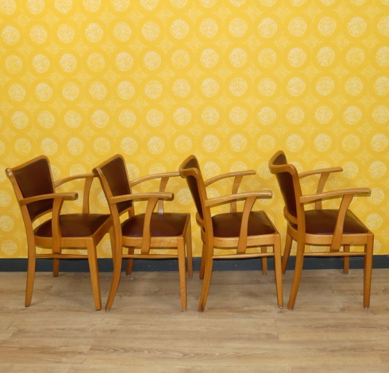 Image 1 of Armchair upholstered spring core skai leather oxblood decorative rivets office chair 60s retro