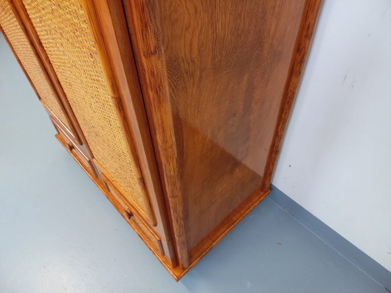 Image 1 of Armadio vintage Maugrion in rattan intrecciato e legno per Roche-Bobois, risalente agli anni '70.