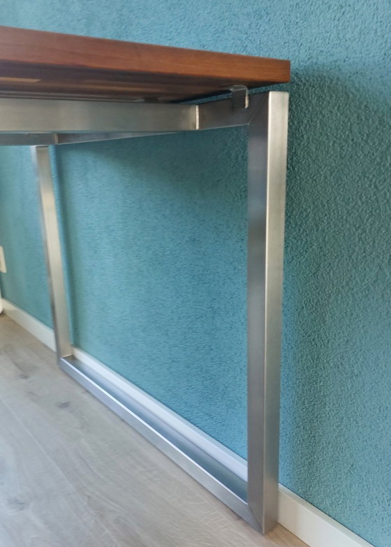 Image 1 of Table de salle à manger design avec plateau en bois et structure en acier inoxydable