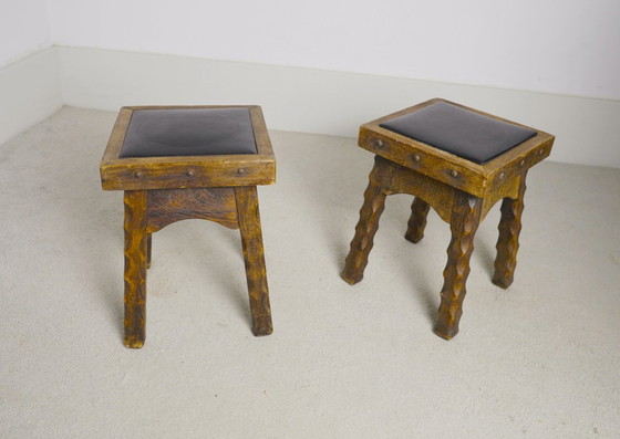 Image 1 of Rustic Oak Stools, 1940s French Hand-Carved Farmhouse Milking Stools, Fireplace Chalet Mountain Decor with Studded Leather Seats