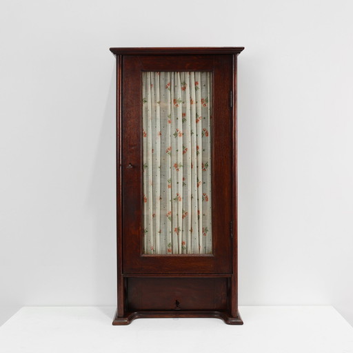 French Art Deco tall cabinet with glass door and hidden compartiment, ca. 1920